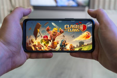 Photo for Kaunas, Lithuania - 2023 April 16: Playing Clash of clans mobile game. Point of view gaming on smartphone. High quality photo - Royalty Free Image