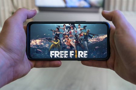 Photo for Kaunas, Lithuania - 2023 April 16: Playing Garena Free Fire mobile game. Point of view gaming on smartphone. High quality photo - Royalty Free Image