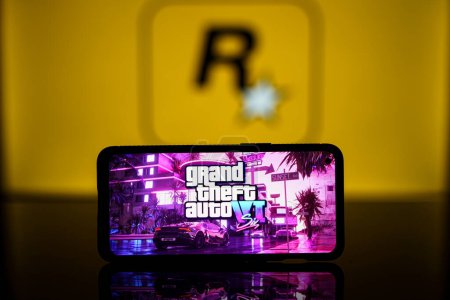 Photo for Paris, France - 2023 November 8: GTA VI logo and Rockstar games company logo in background on screen. Rockstar games announces to release GTA SIX video game. High quality photo - Royalty Free Image