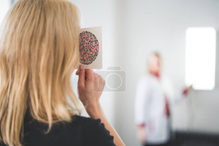Patient taking eye test at clinic. High quality photo