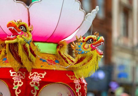 Photo for Dragon dance during Chinese lunar year celebrations in London, England - Royalty Free Image