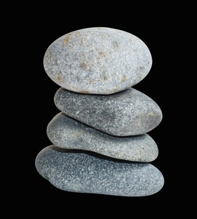 Photo for Balancing stone or rock isolated, natural pebble with clipping path, no shadow in black background - Royalty Free Image