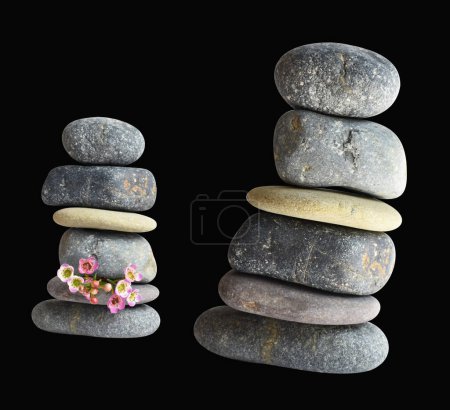 Photo for Balancing stone or rock isolated, natural pebble with clipping path, no shadow in black background - Royalty Free Image
