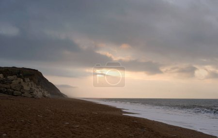 Photo for Sunrise on the beach, cloudy day - Royalty Free Image