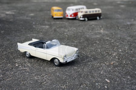 Photo for East Kutai, Indonesia - 31 Decembber 2020: Closeup of 1957 chevrolet belair car toys, Volkswagen combi toys background - Royalty Free Image