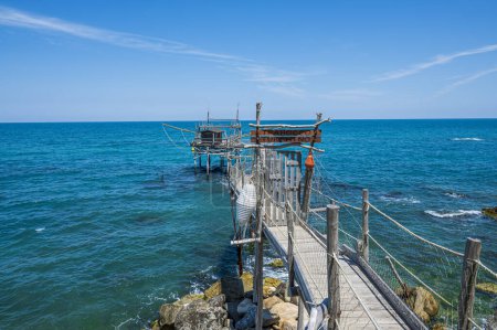 Photo for San Vito Chietino - 07-08-2022: High angle view of the Trabocco Turchino with a clear blue sea - Royalty Free Image