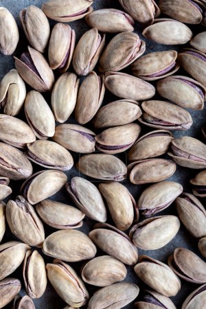 Téléchargez les photos : Texture et fond de pistache. Délicieuses cacahuètes comme fond. Fond en pistaches salées (en coquille)). - en image libre de droit