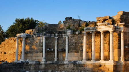Photo for The ruins of an old theater with columns in a medieval city. Panorama. The concept of historical monuments. A journey through the ancient cities of the Mediterranean - Royalty Free Image