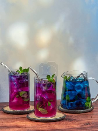 Iced blue tea made from Anchan flowers also known as butterfly pea (Clitoria ternatea), top copy space
