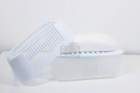 Photo for Plastic dehumidifier with granules at home. combating moisture and mold in the home - Royalty Free Image