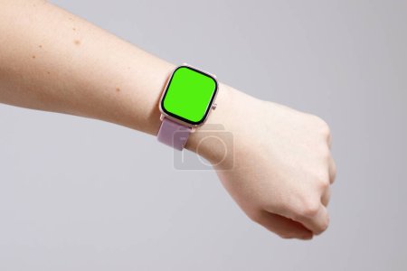 Smart watch on hand with chroma key display for copy space, add text or logo