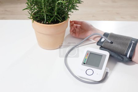 Photo for Patient measuring blood pressure. Hypertension. - Royalty Free Image