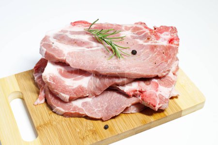 Photo for Fresh raw pork meat, pork tenderloin steaks ready to be cooked - Royalty Free Image