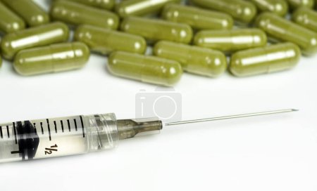 Photo for Green tablets and capsules, close up. healthcare concept - Royalty Free Image