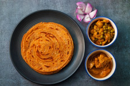 Photo for Popular Indian fried flat bread "laccha Paratha". Made of wheat flour. - Royalty Free Image