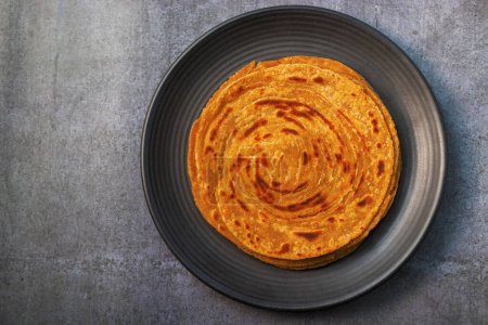Photo for Popular Indian fried flat bread "laccha Paratha". Made of wheat flour. - Royalty Free Image