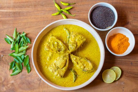 Photo for Selective focus of Illish or Hilsa fish cooking with mustard seed.famous in India and Bangladesh. - Royalty Free Image