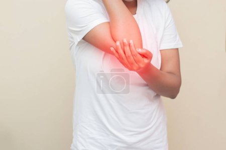 Photo for Imitative representation of an Indian lady feeling elbow pain. - Royalty Free Image