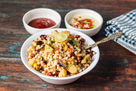 Sabudana Khichdi is a gluten-free Indian dish made with soaked tapioca pearls, potatoes, peanuts, and spices. Its popular during fasting days.