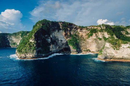 Photo for Nusa Penida coastline with cliffs and ocean with evening light. Aerial view - Royalty Free Image