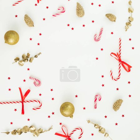 Photo for Christmas frame with tree decoration, red confetti and candy canes. Flat lay, top view. New Year celebration - Royalty Free Image