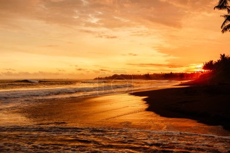Photo for Warm sunset with ocean waves and beach in Bali - Royalty Free Image