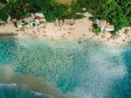 Téléchargez les photos : Aerial view of blue ocean and coastline with cozy hotels on Impossibles beach in Bali island - en image libre de droit