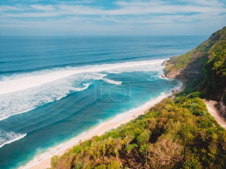 Foto de Amazing view of scenic coastline with beach, mountains and blue ocean in Bali. Nyang Nyang beach. - Imagen libre de derechos
