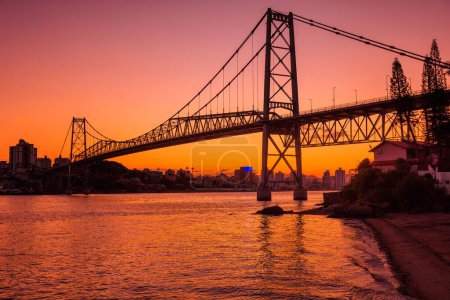 Photo for Hercilio luz old bridge with warm sunset in Florianopolis - Royalty Free Image