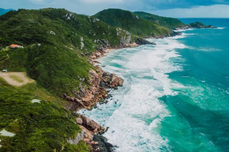 Photo for Scenic coastline with stormy ocean and scenic cloudy sky. Aerial view with mountains and ocean with waves - Royalty Free Image