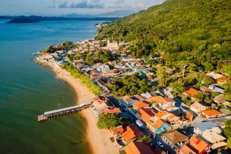 Photo for Touristic village with pier and church in Ribeirao da Ilha, Florianopolis, Santa Catarina, Brazil. - Royalty Free Image