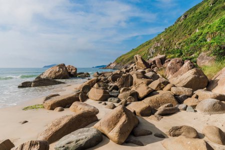 Photo for Ocean beach with stones and mountain in Brazil, Florianopolis - Royalty Free Image
