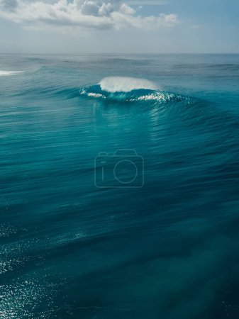 Photo for Perfect glassy wave with barrel in blue ocean in Bali. Aerial view - Royalty Free Image