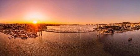 Panoramic aerial view of Hercilio luz cable bridge with sunset light in Florianopolis, Brazil