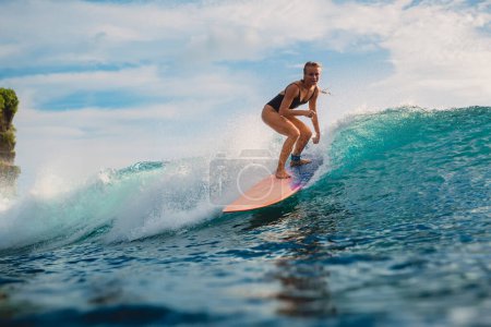 Photo for Surf girl on surfboard. Woman in ocean during surfing. Surfer on longboard and ocean wave - Royalty Free Image