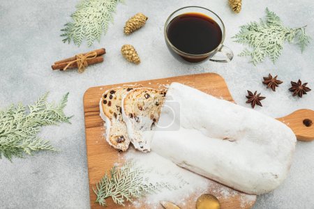 Photo for Christmas table with stollen cake and coffee cup with decor. Flat lay, top view - Royalty Free Image