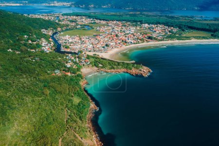 Aerial view of coastline with beach, mountains and ocean in Brazil. Barra da lagoa in Florianopolis