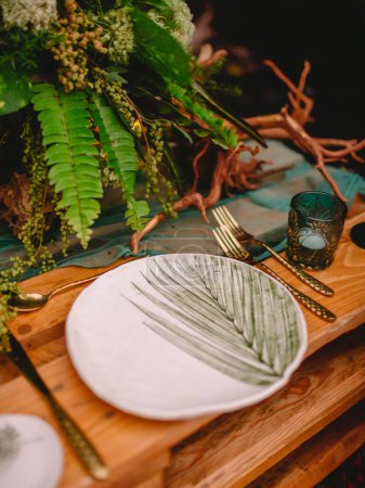 Photo for Boho style table setting with a blank card decorated with fern branches close up, Wedding Mockup. Romantic table with paper invitation card. - Royalty Free Image