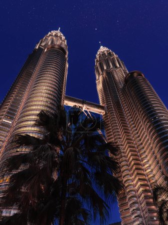 Photo for Twin towers in KL center. Skyscrapers at night - Royalty Free Image