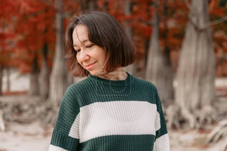 Photo for Portrait of smiling woman in autumnal park. Stylish woman with happy emotions - Royalty Free Image