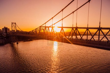 Hercilio luz cable bridge with sunset light in Florianopolis. Aerial view