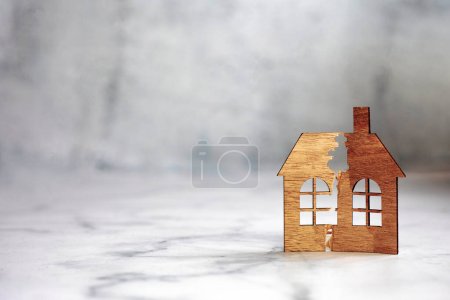 Photo for The division of the property. The destruction of the family. A broken house. Divorce and division of property. A symbol of family problems. divorce concept copy space space for text - Royalty Free Image
