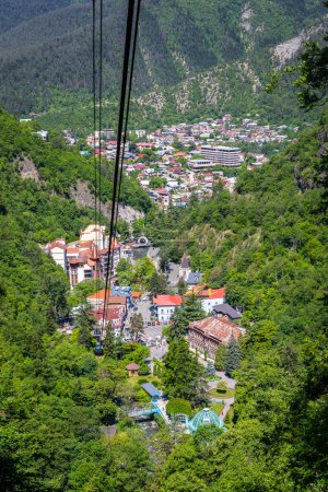 Photo for Borjomi town aerial view seen from cable car above the city, resort town in green Borjomi Gorge, Borjomi-Kharagauli National Park, Caucasus, Georgia. - Royalty Free Image