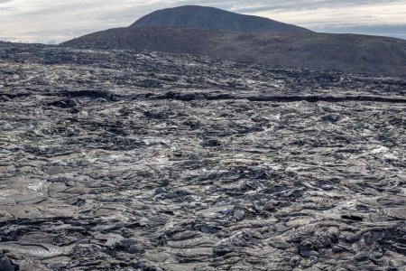 Fagradalsfjall volcano lava field with frozen basaltic lava created after eruption and steaming vents, Iceland.