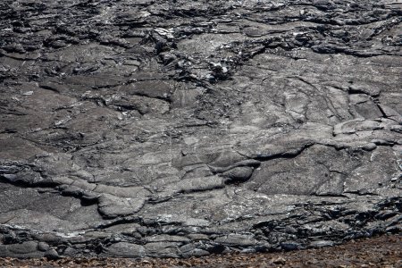 Foto de Textura de lava de basalto fundido en el campo de lava del volcán Fagradalsfjall creado después de la erupción, Islandia, vista de cerca. - Imagen libre de derechos