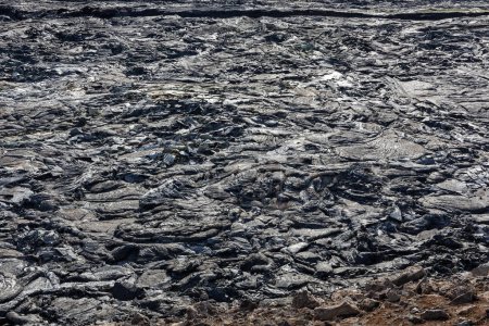 Texture de lave de basalte fondu au champ de lave du volcan Fagradalsfjall créé après éruption, Islande, vue rapprochée.