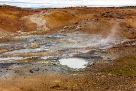 Seltun Geothermal Area in Krysuvik, landscape with steaming hot springs and orange colors of sulphur soil, Iceland.