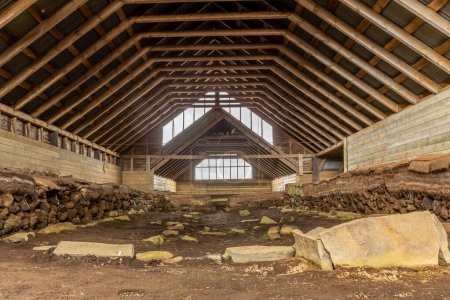 Stong, inside view of the viking-era farmstead longhouse in Iceland in the Thjorsardalur valley, symmetrical view.