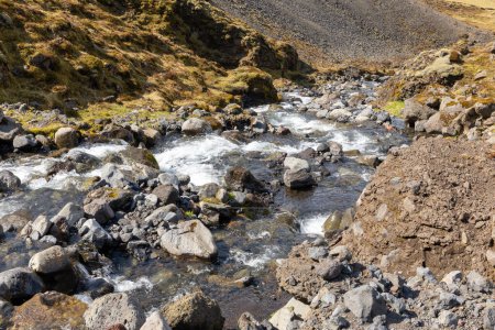 Wild river stream in the mountains of Thorsmork valley in South Iceland, hiking trail in Thorsmork.