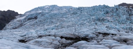 Skaftafell Glacier panorama, part of Vatnajokull National Park, Iceland. Blue glacier ice with cracks and crevasses.